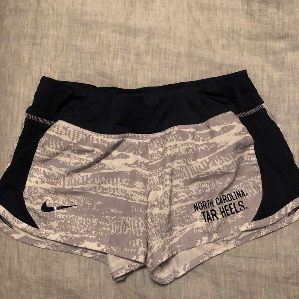 Nike running shorts with NC Tar Heels logo, size S